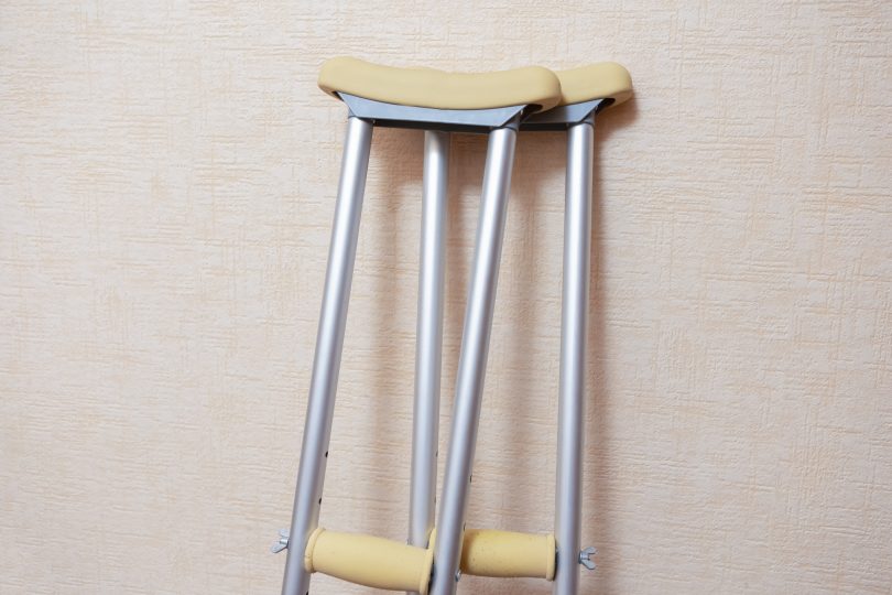 Crutches leaning against a wall