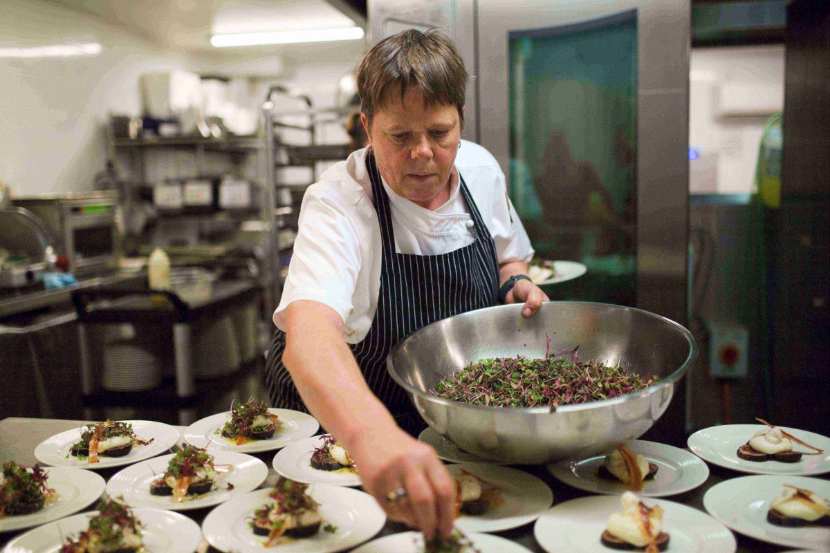 Chef plating up dishes