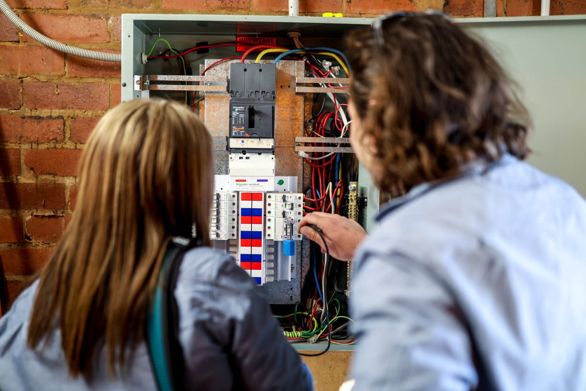 Electricians test fuses and wiring 