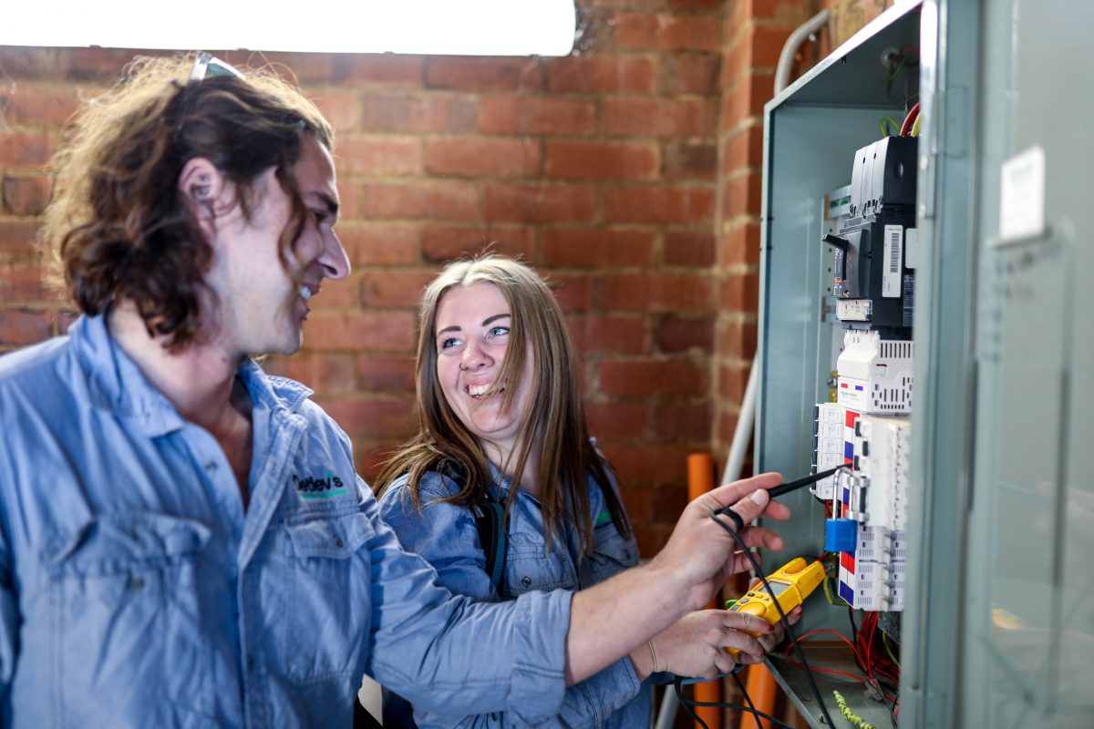 Electricians test fuses and wiring
