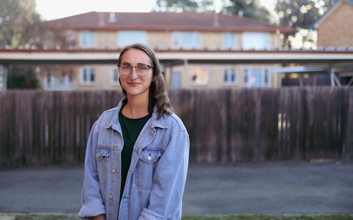 Person standing outside house