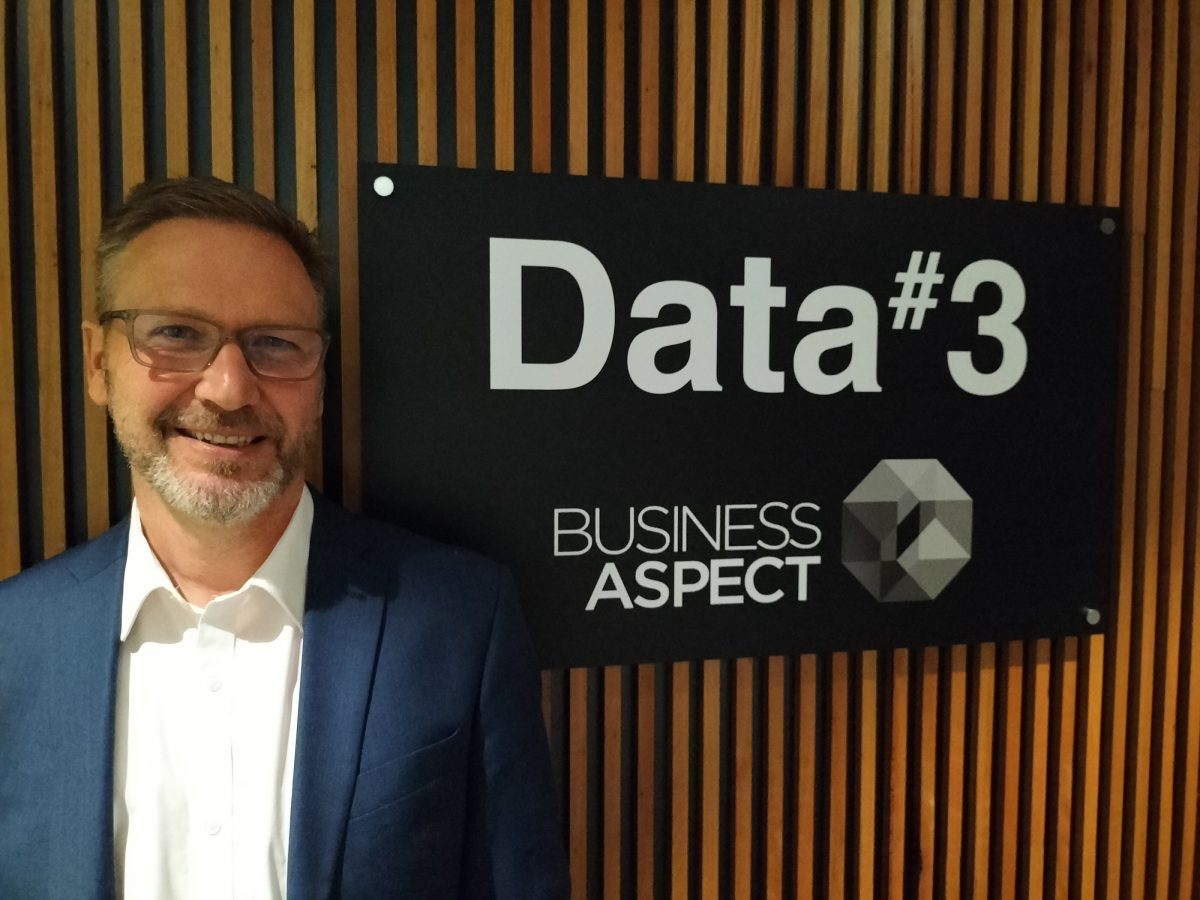 New ACT general manager Mike Hobson in front of a Data#3's sign