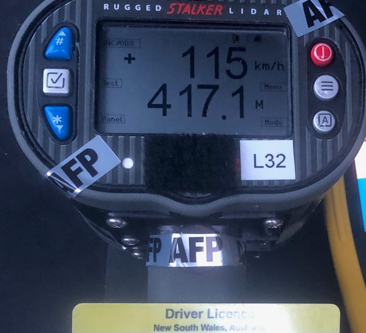 Speed radar showing 115 km/h reading