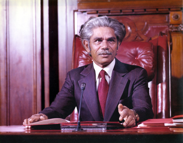 First Indigenous Parliamentarian Neville Bonner sits in his Senate chair. 