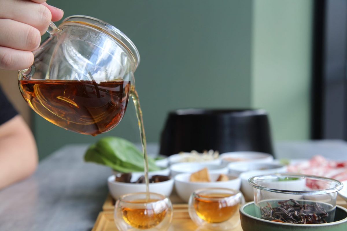 Tea pouring into a cup