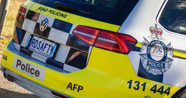 Man charged with eight offences after alleged stabbing and carjacking in Belconnen car park