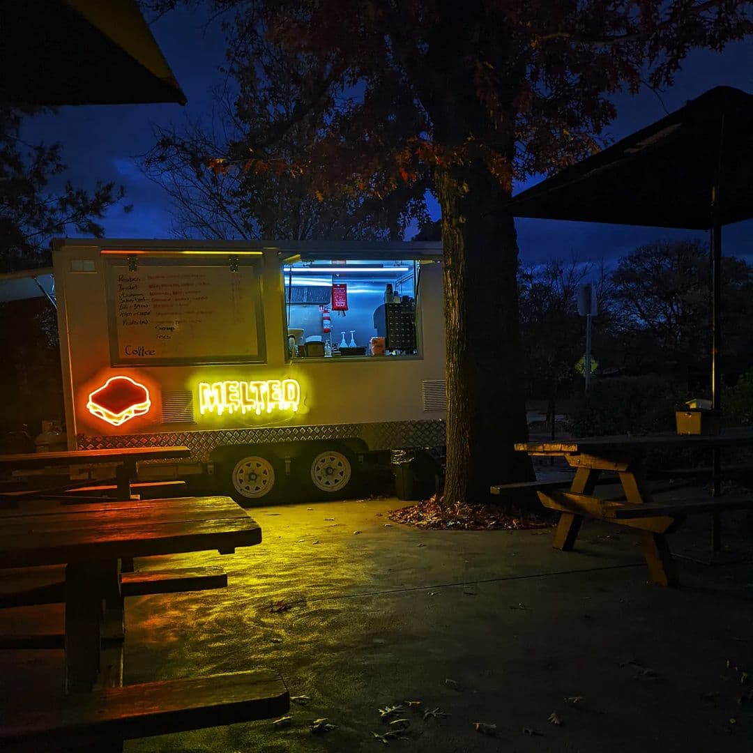 Food van with colourful neon lights