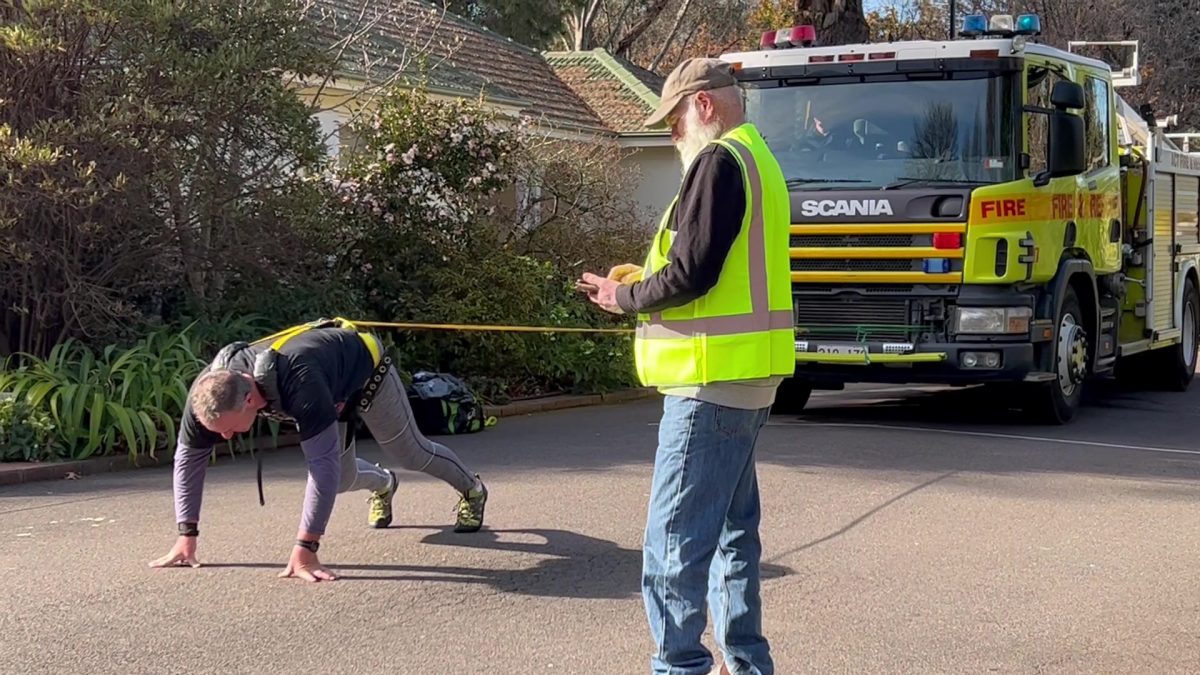 Man pulls fire truck.