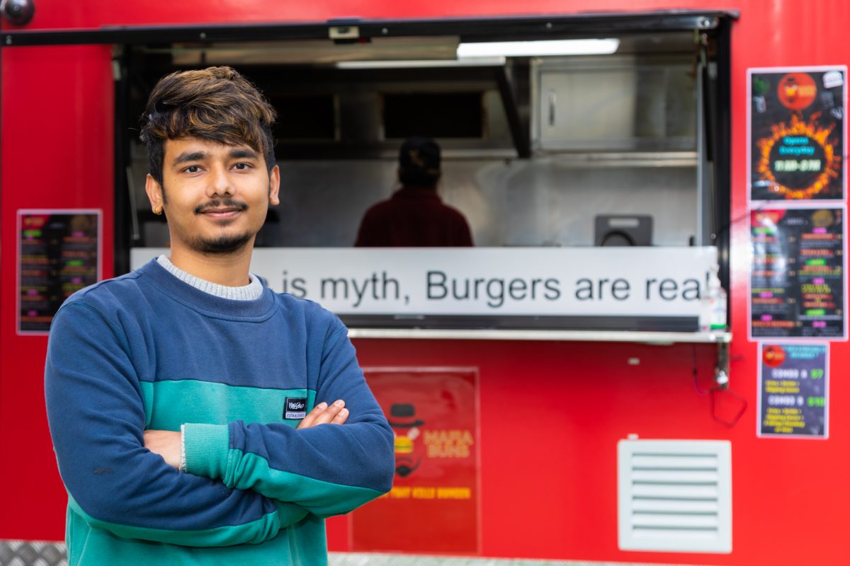 Man in front of food truck