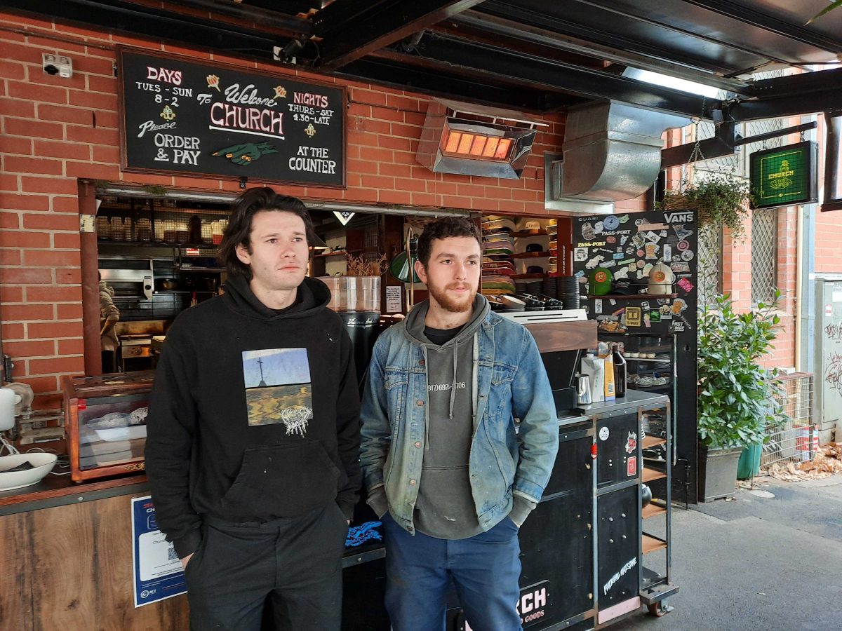 Two men outside a cafe