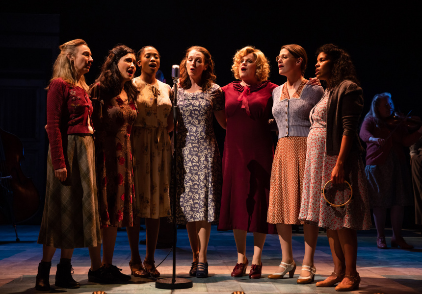 women singing on stage