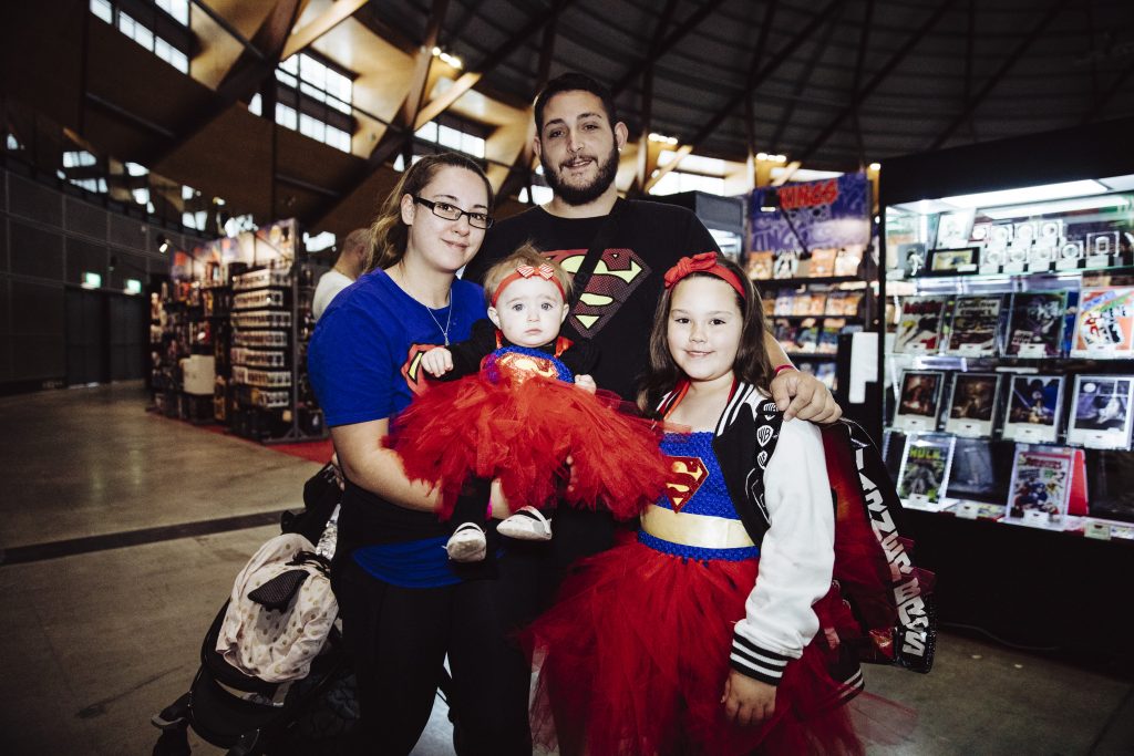 Family dressed in Superman themed costumes