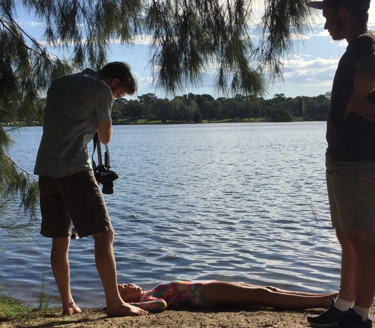 Young film maker Will Scott filming with a camera