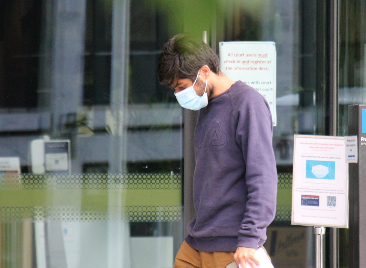 Man in mask outside court