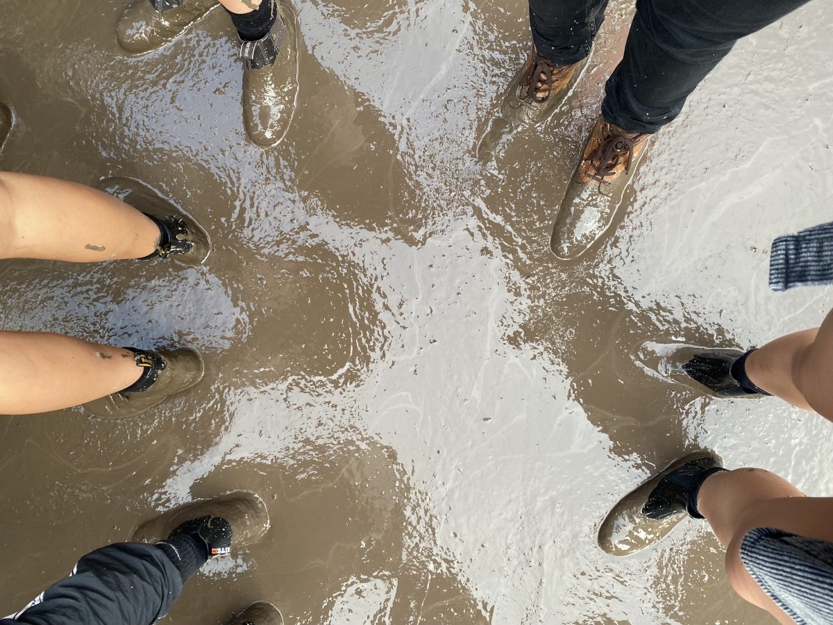 People standing in mud