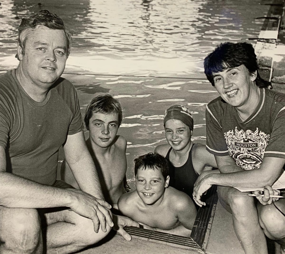 Carol and the late Terry Gathercole, with three swimmers.