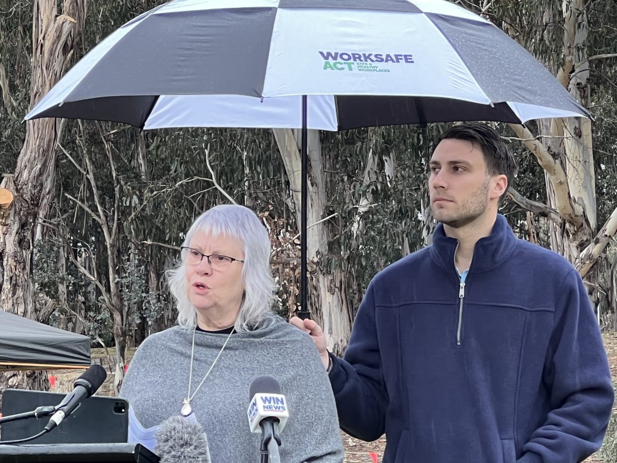 Kay and Jack Catanzariti under an umbrella 