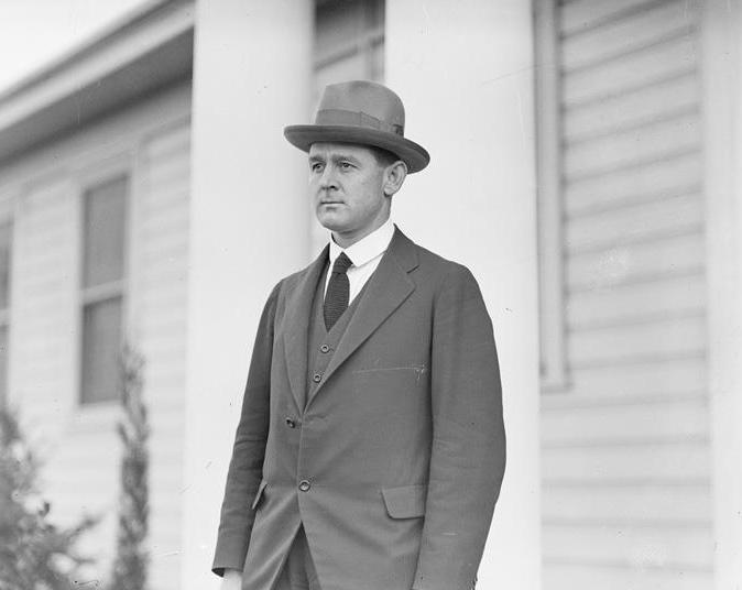 Man in a suit wearing a hat