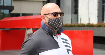 Ex-bikie president Ali Bilal, who was 'happy to go to jail', is sentenced to 13 months over threatening calls