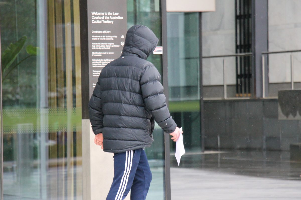 Man in hoodie leaving court