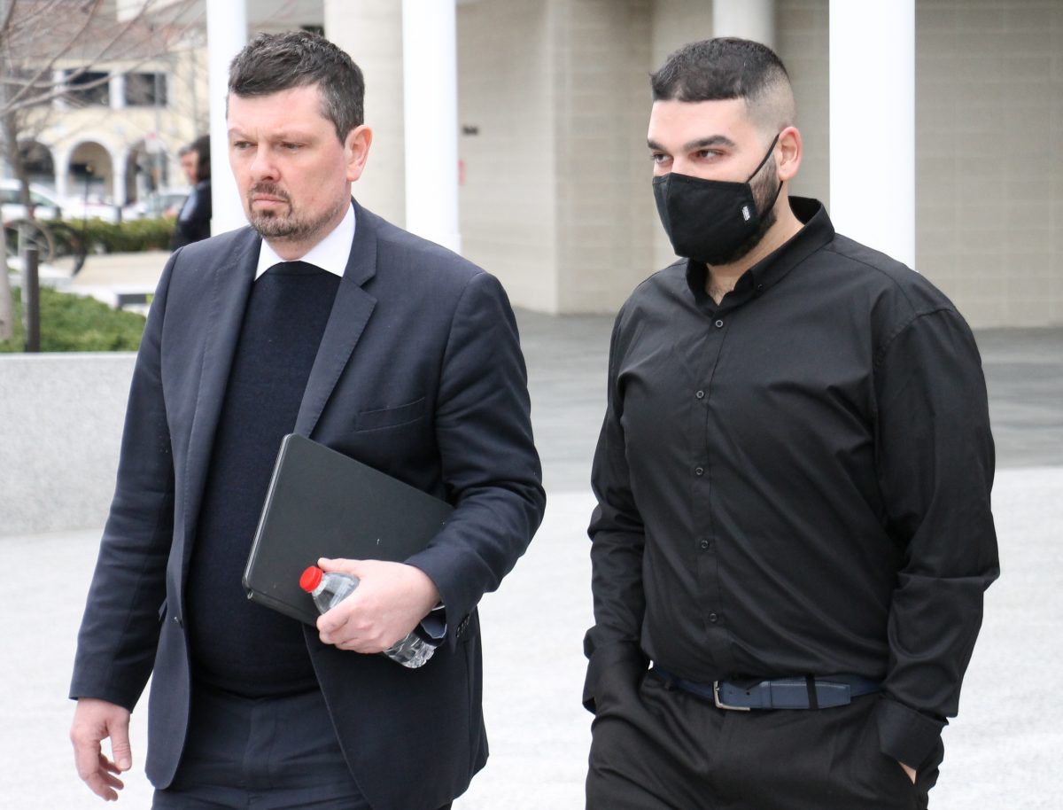 Two man leaving court