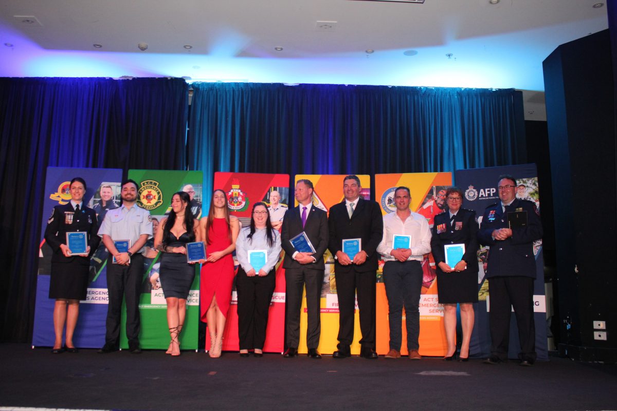 ACT Rotary Emergency Services Community Awards finalists lined up against banners