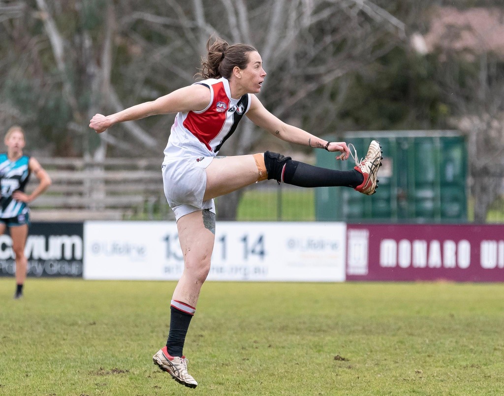 Woman playing AFL