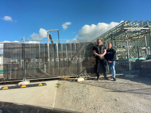 Man and woman at building site