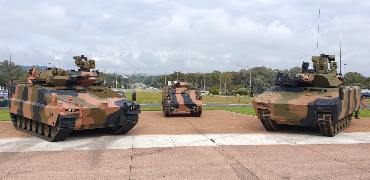  The Hanwha Redback (left) and Rheinmetall Lynx (right) dwarf the Vietnam-era M113AS4 vehicle one of them will replace during a 2021 open day at Canberra’s Blamey Square.