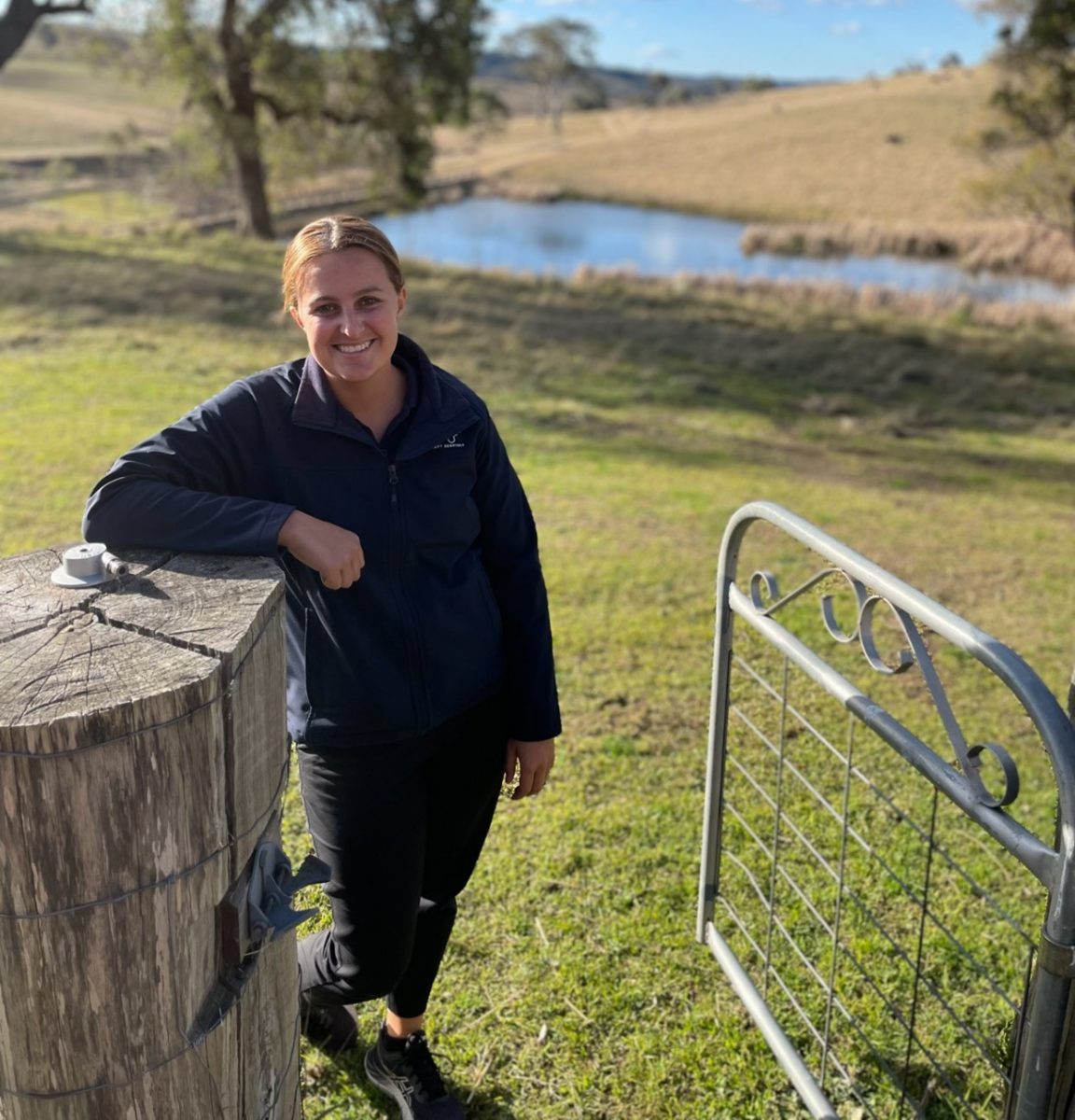 Woman standing in a paddock