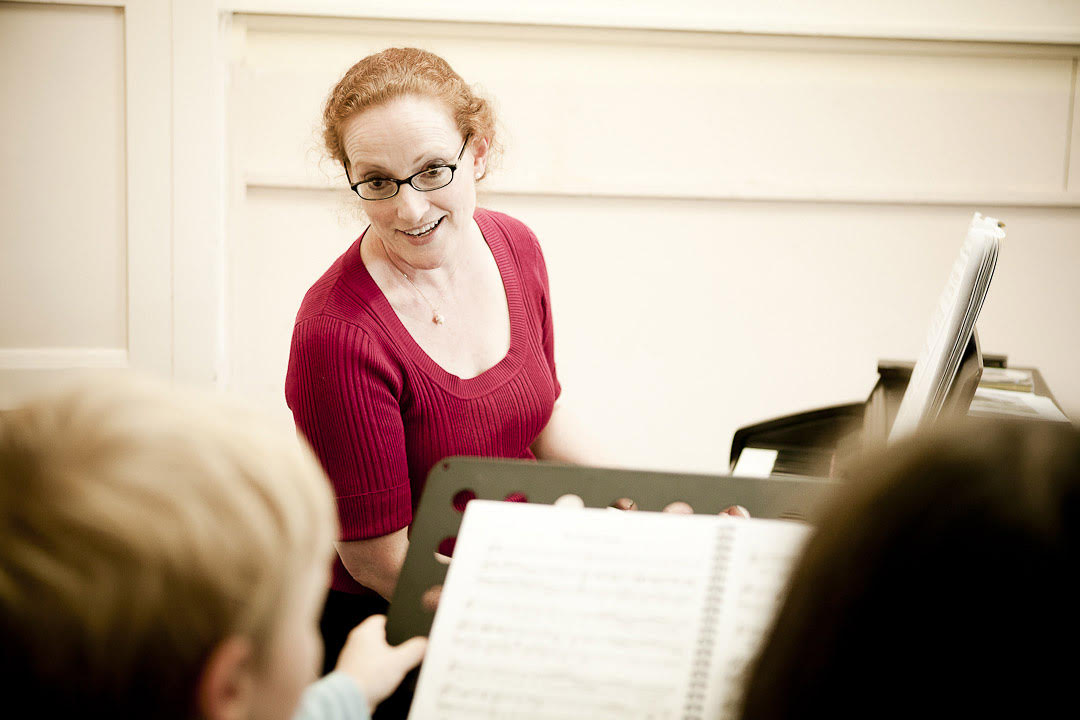Music teacher with children