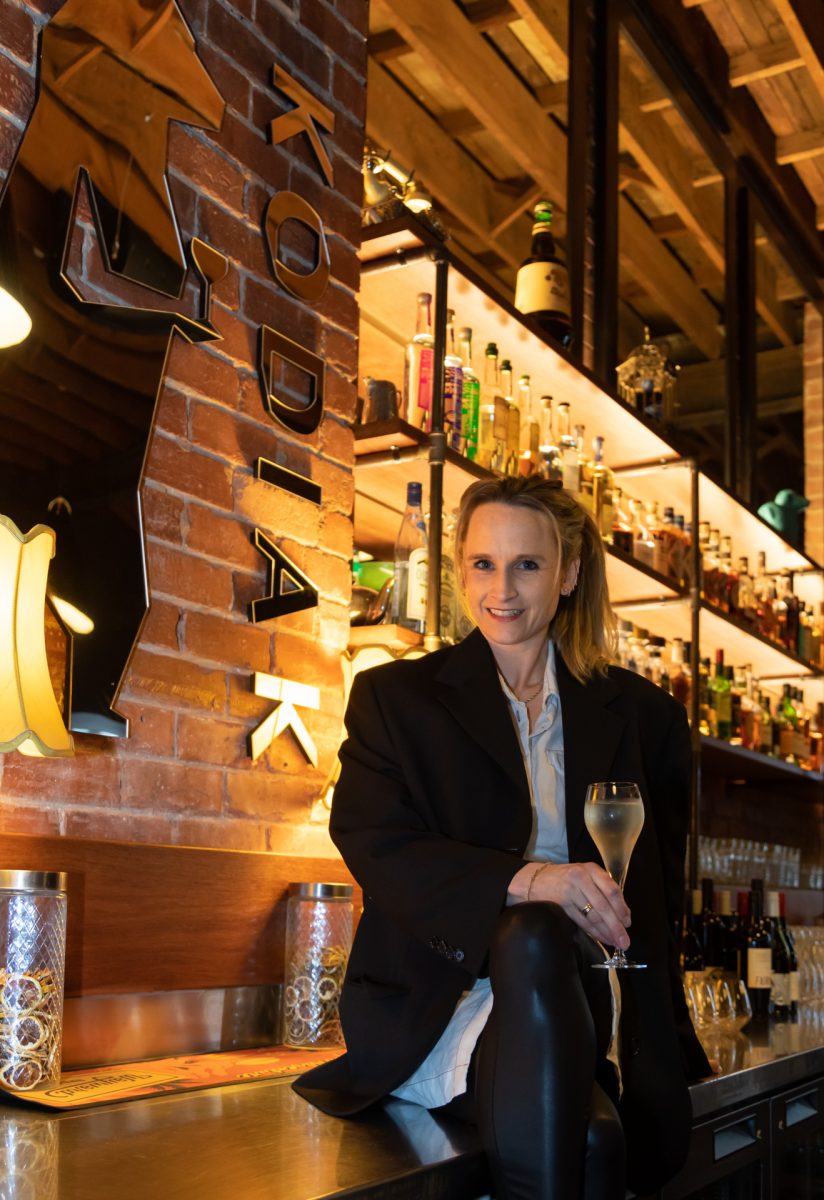 Woman sitting on bar