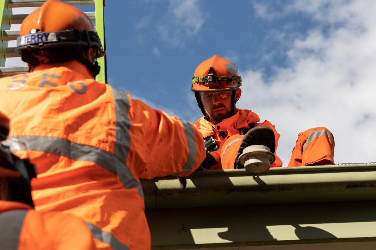 SES volunteers on roof