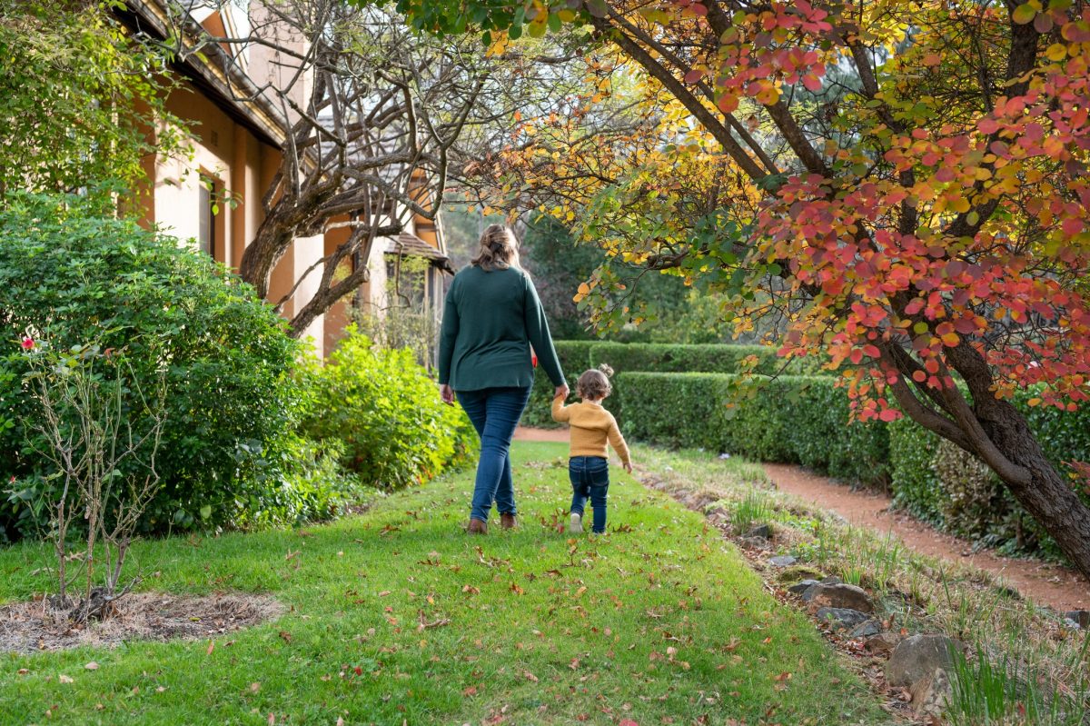 Mother and toddler walking