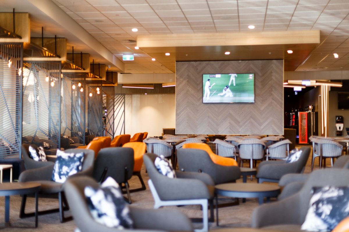 interior of club with chairs and screen