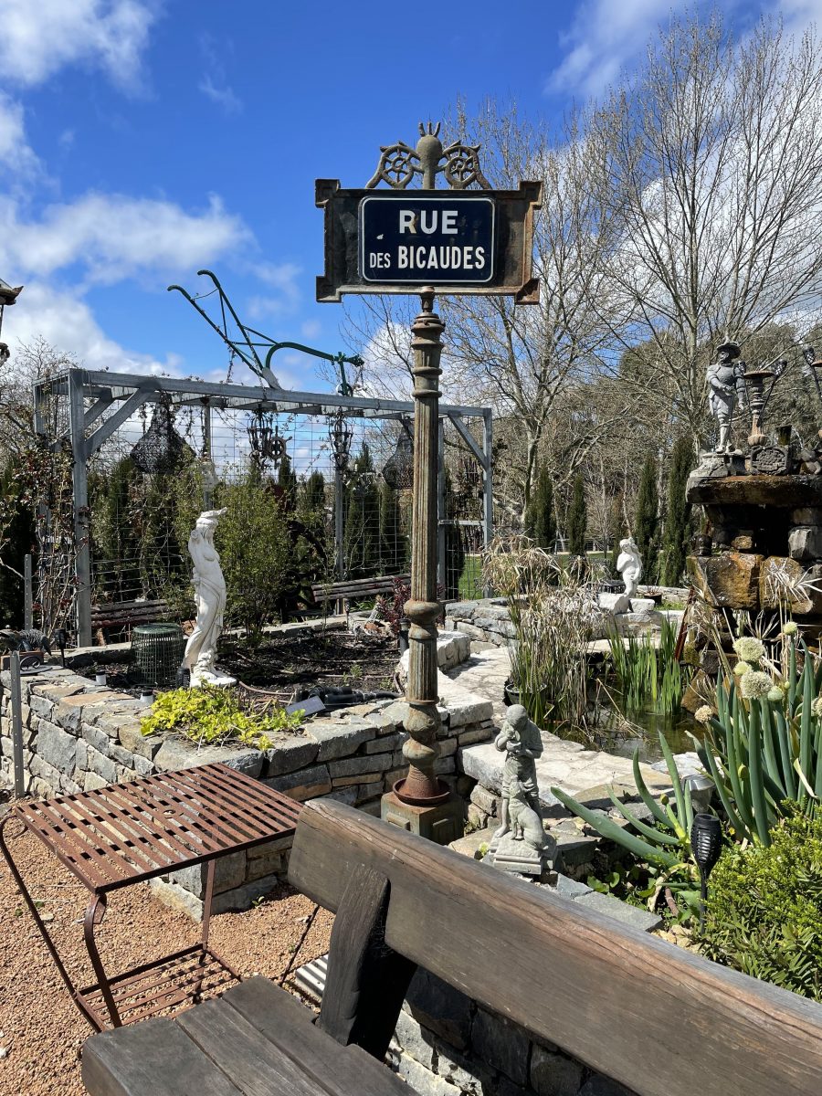 French street sign in garden