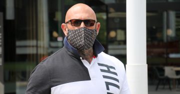 Ranting ex-bikie boss has jail time reduced on appeal