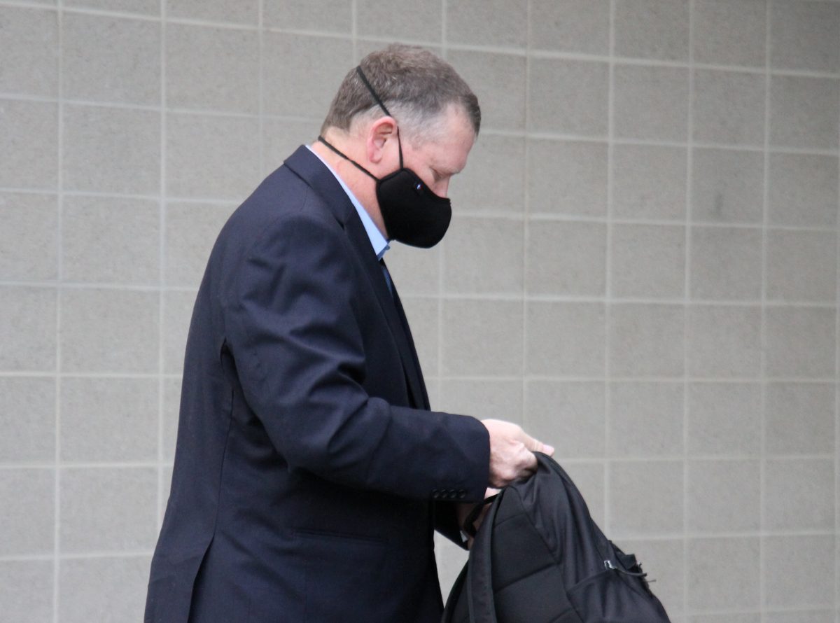 Man approaching court in a mask