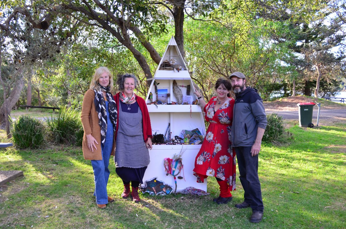 Four people standing outdoors