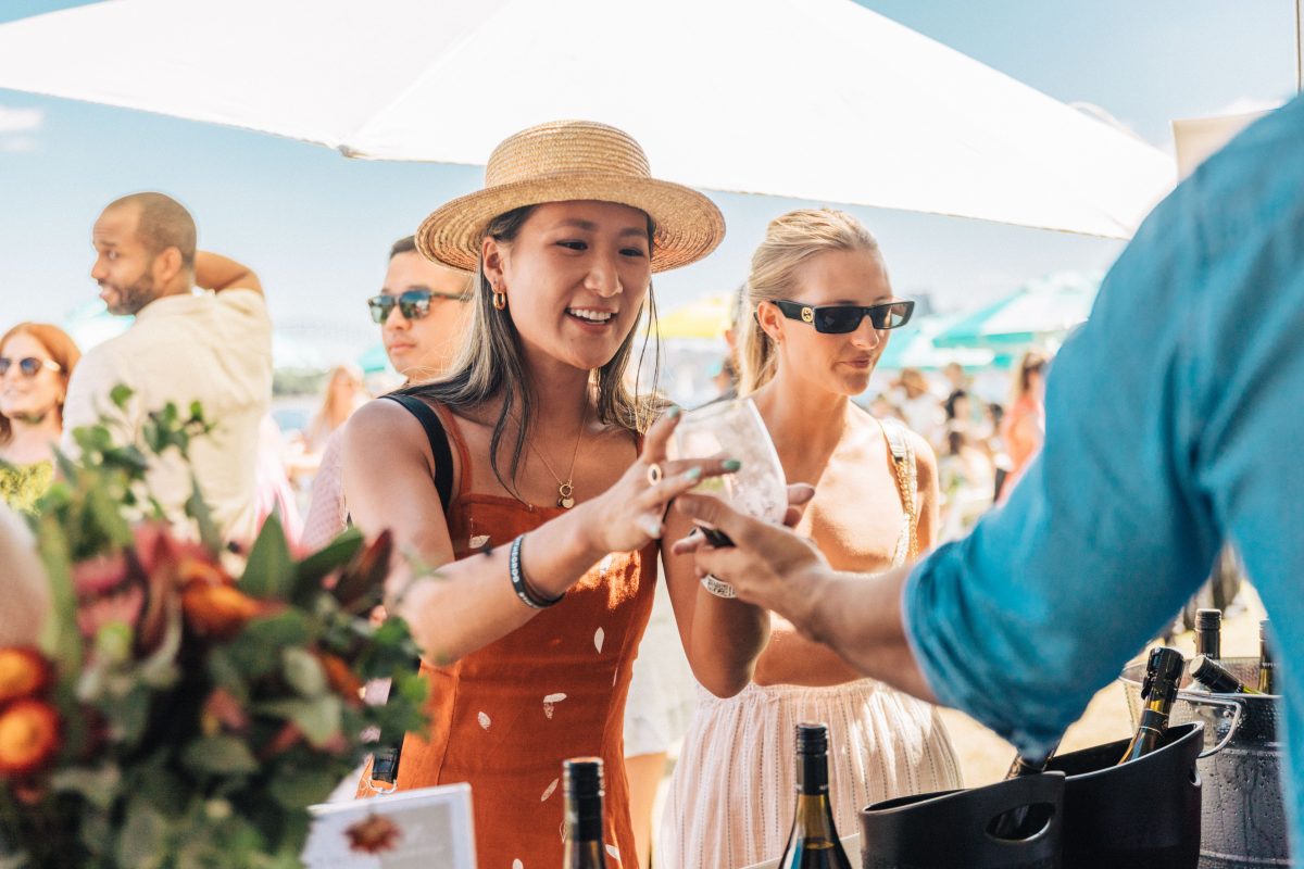 woman purchasing a glass of wine 