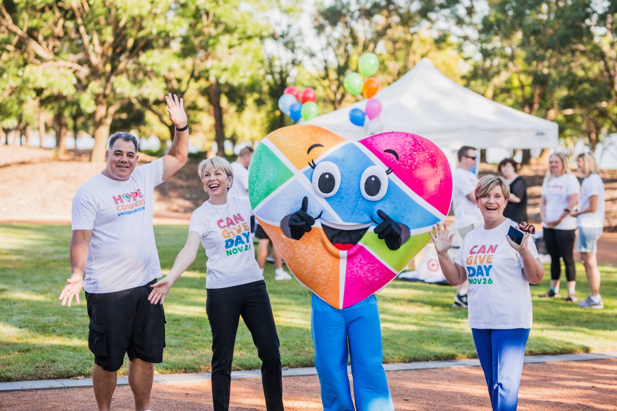 Three people with a heart costume