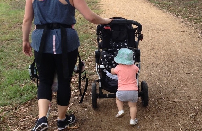 Mother with child and a pram