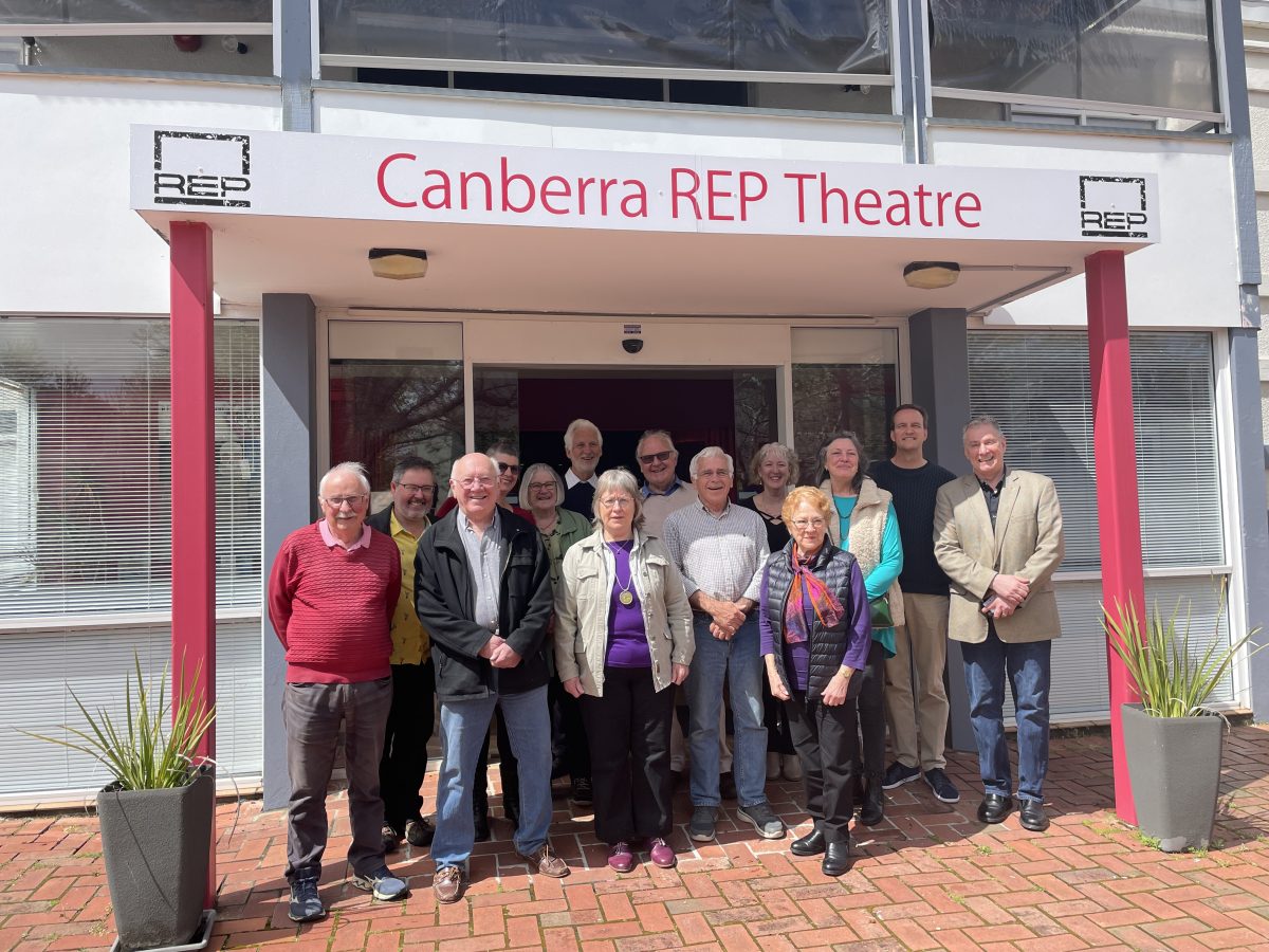 People outside a theatre entrance