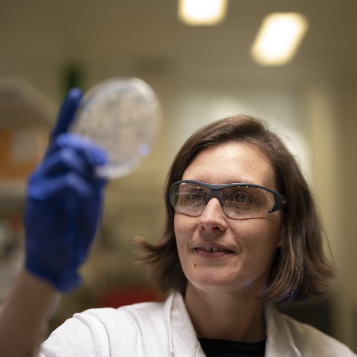 Woman looking at specimen