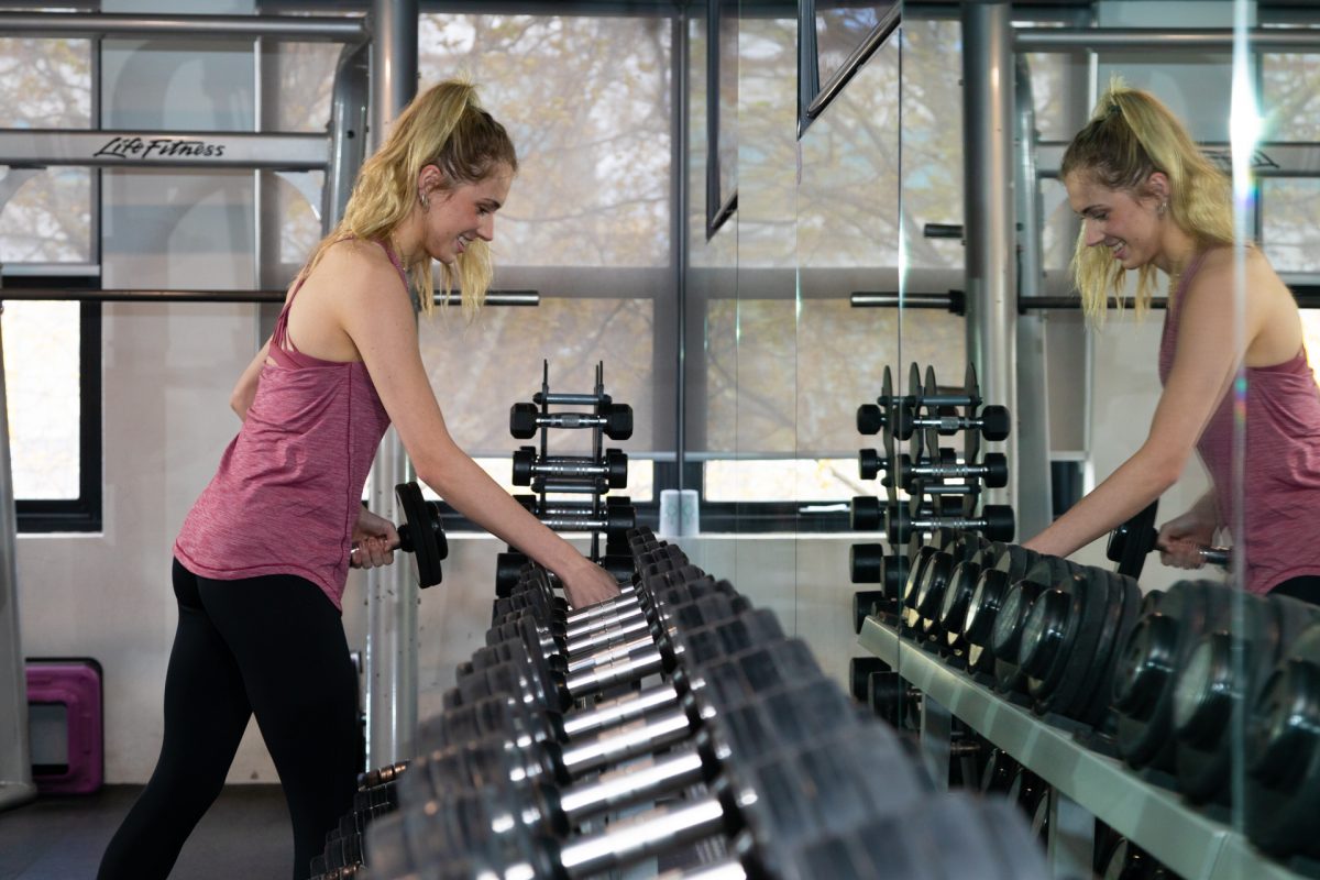 Girl holding weights