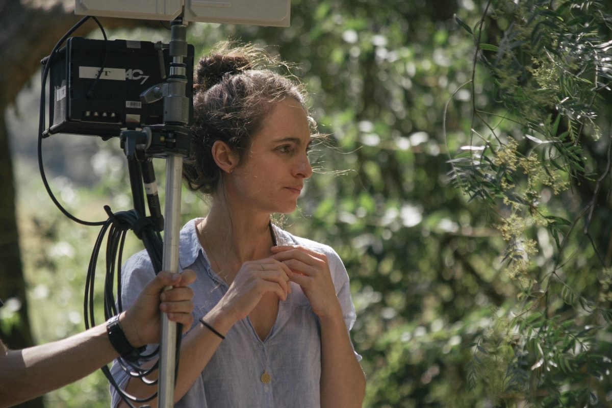 Woman with movie equipment