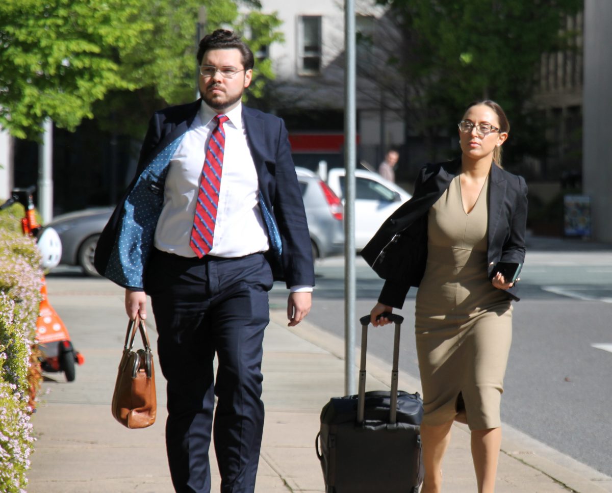 Man and woman walking to court
