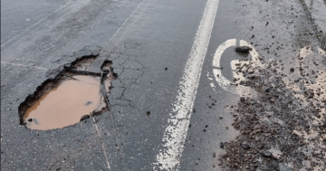 Crews battle to stay on top of potholes and grass as wet won't let up