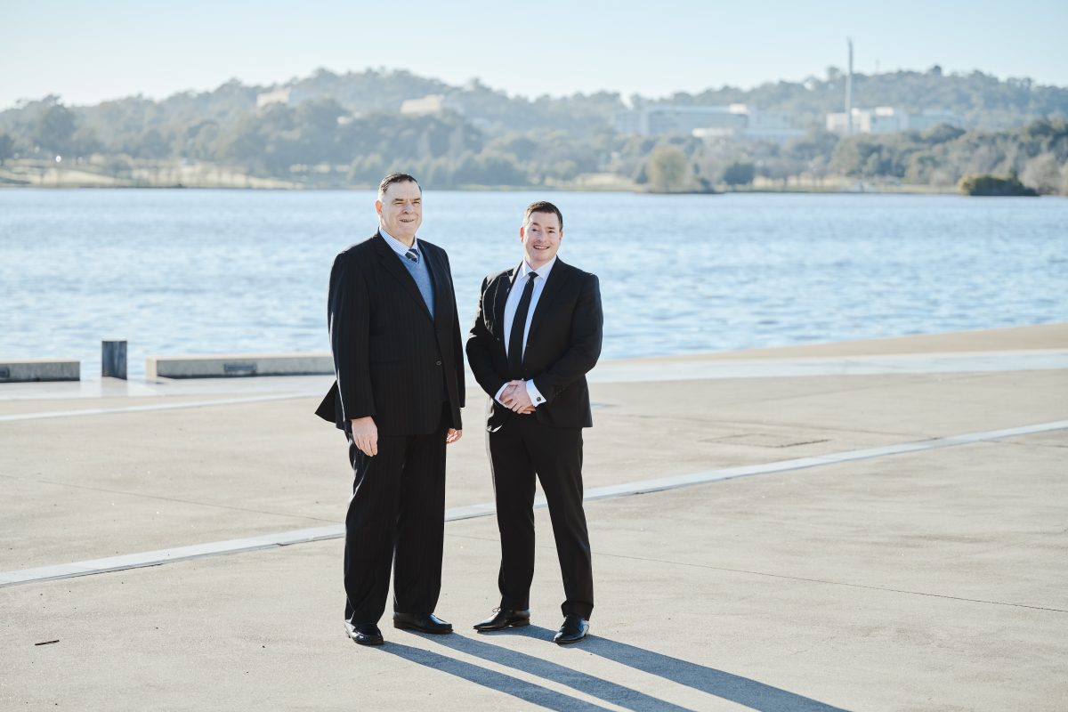 Two men standing on a dock