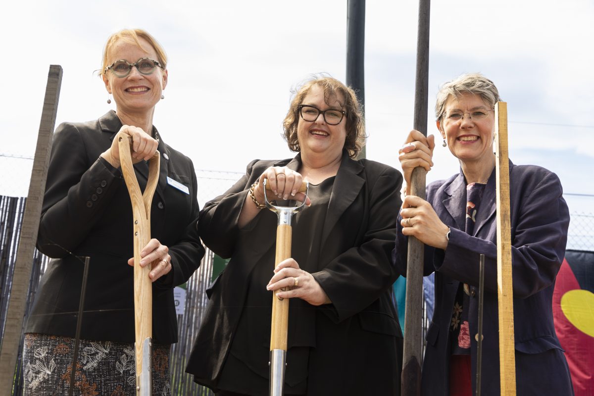 Lucy Hohnen, Carolyn Doherty and Jane Crowley stand with shovels at the Good Works Garden launch
